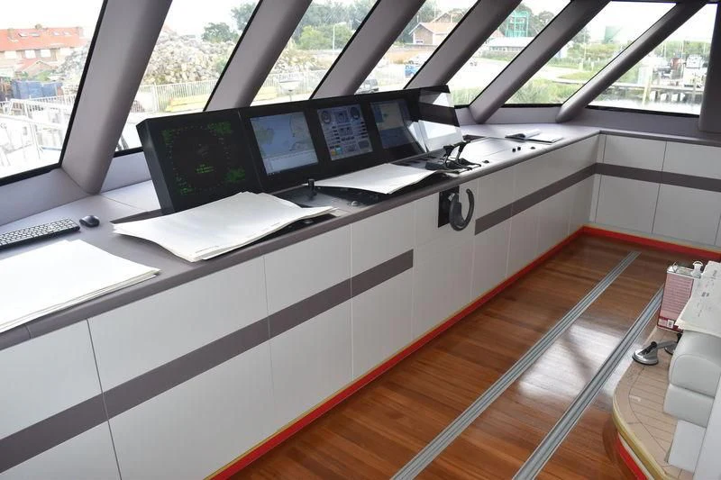 a desk with computers on it aboard BRAVADO Yacht for Sale