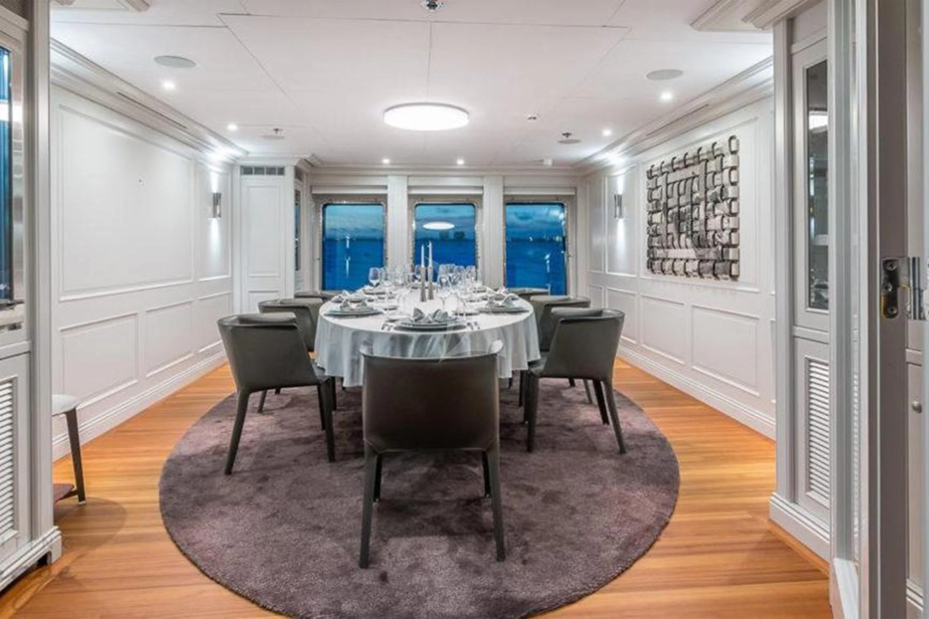 a room with a table and chairs aboard BRAVADO Yacht for Sale
