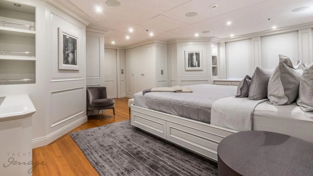 a large bedroom with a large bed aboard BRAVADO Yacht for Sale