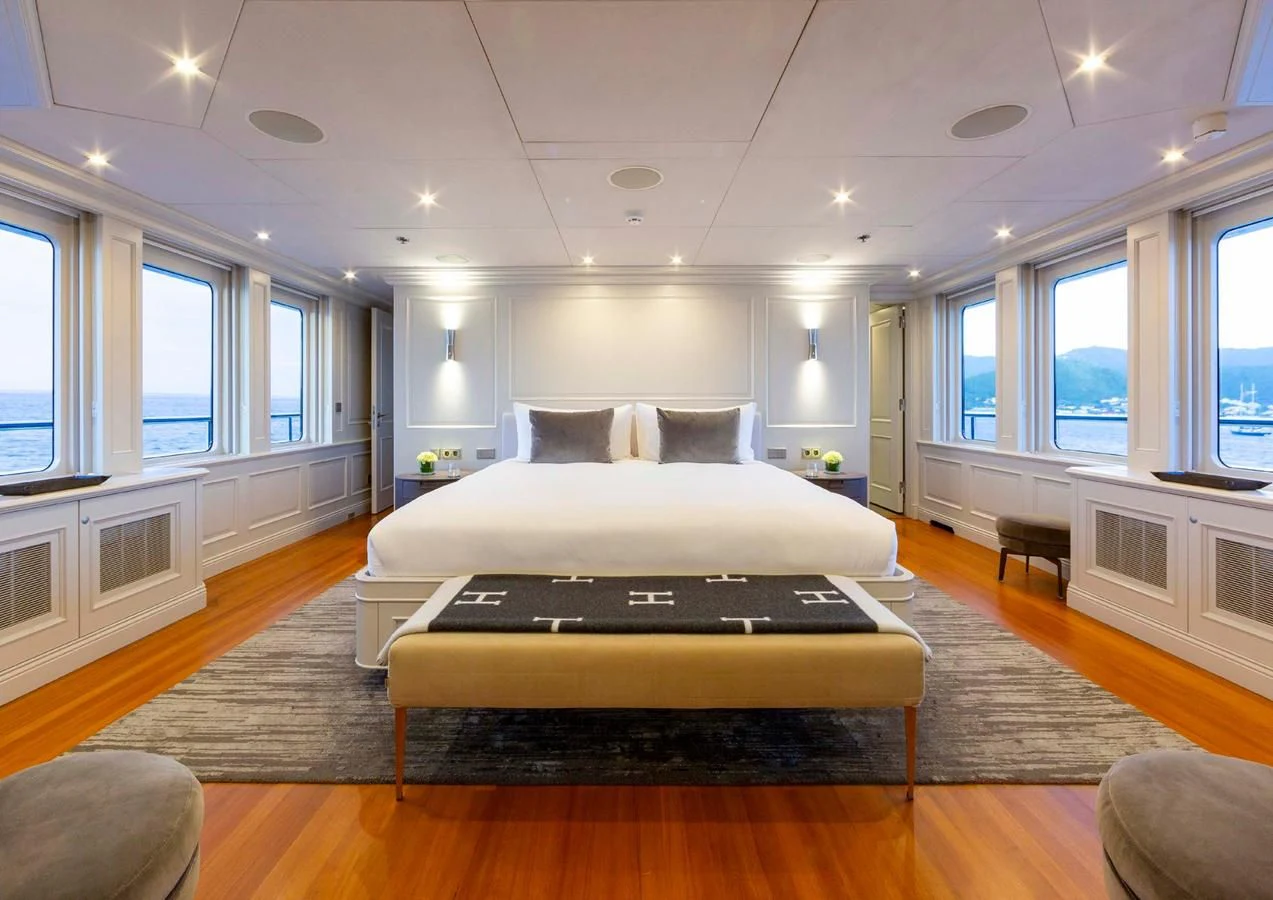 a large bedroom with a large bed aboard BRAVADO Yacht for Sale