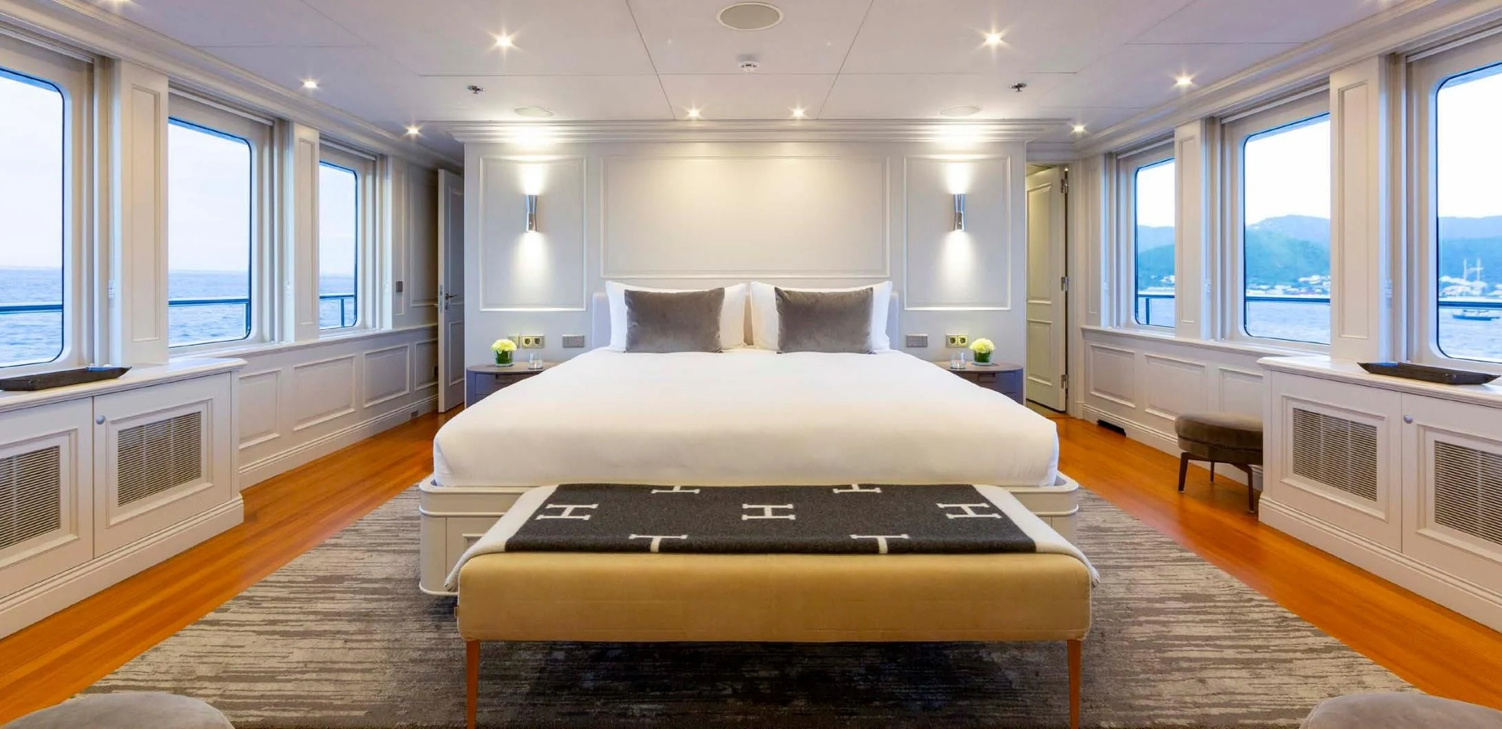 a large bed in a room aboard BRAVADO Yacht for Sale
