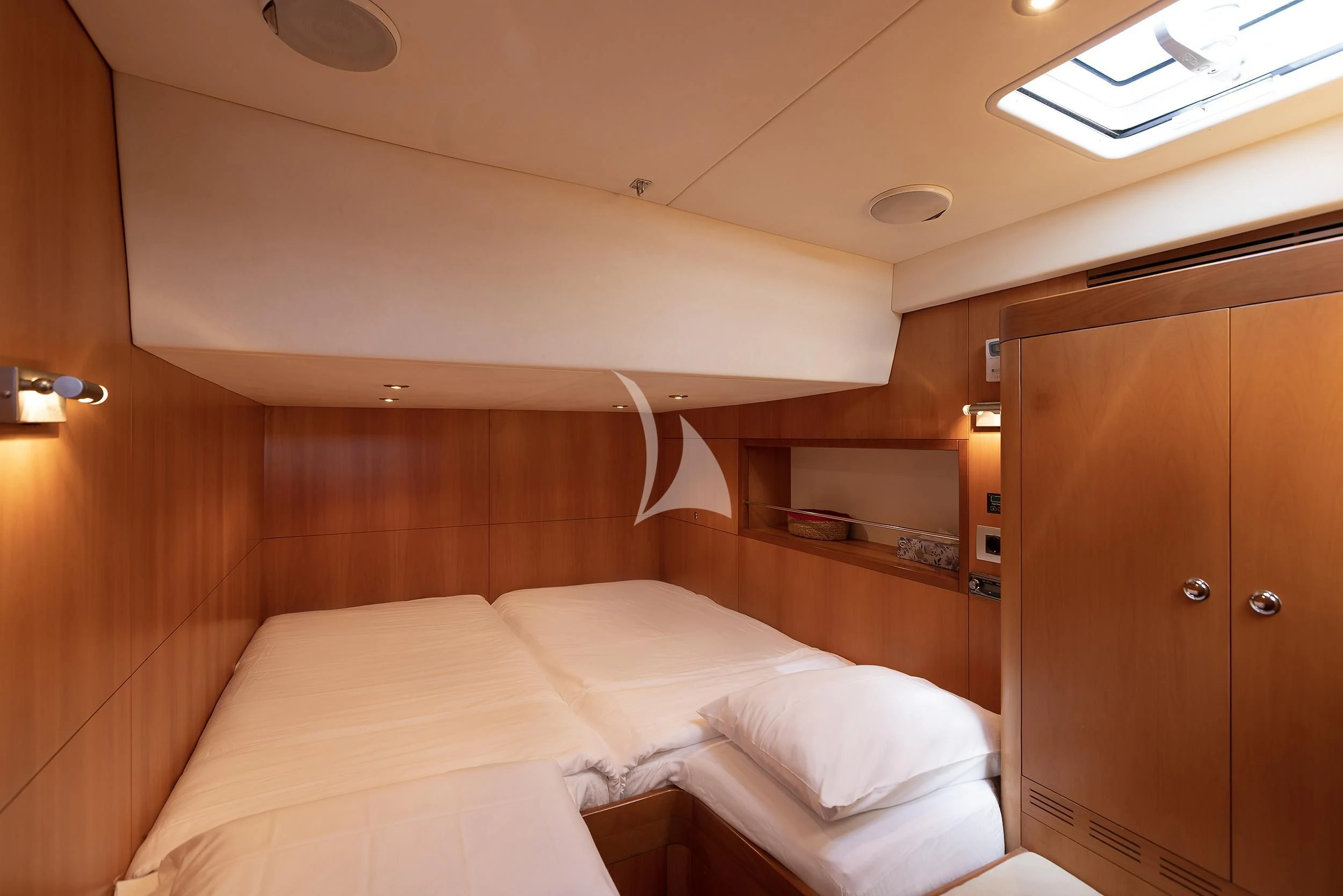 a room with a bed and a closet aboard MELITI Yacht for Sale