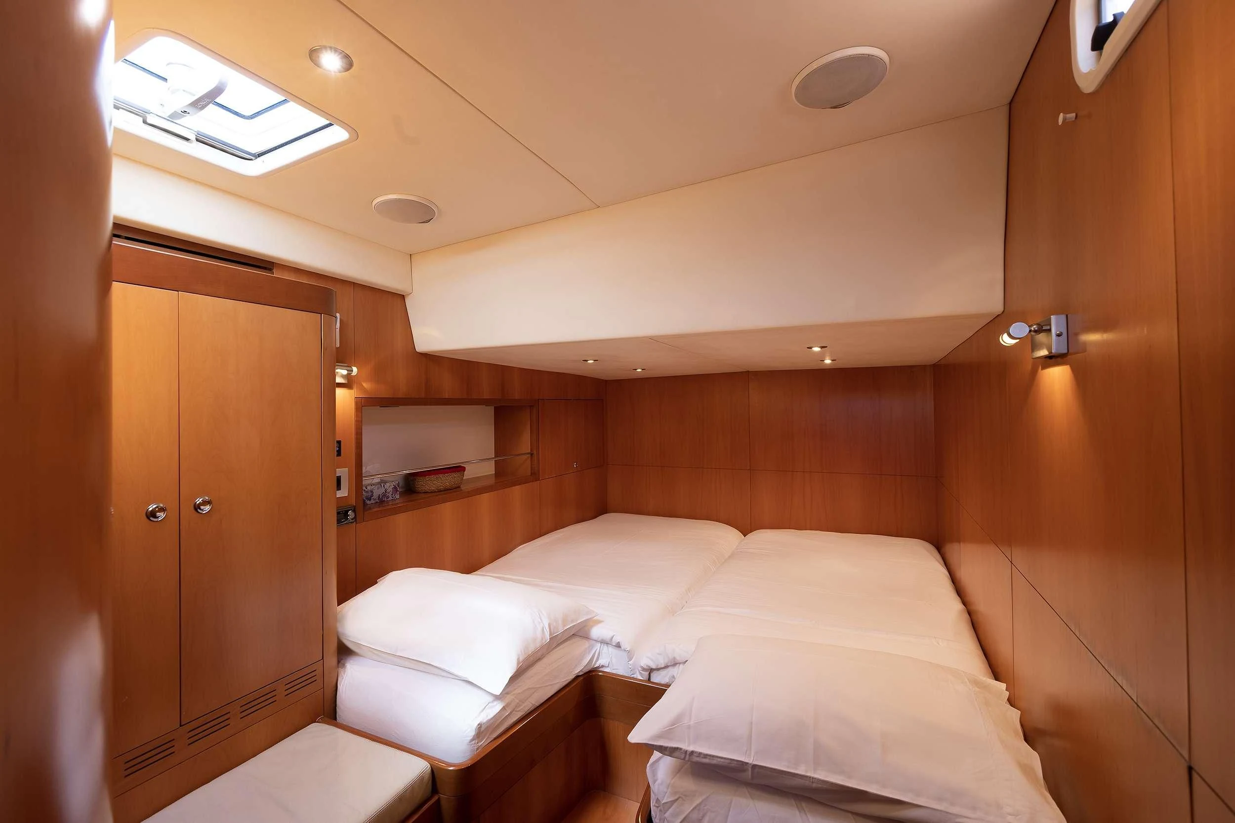 a room with a bed and a closet aboard MELITI Yacht for Sale