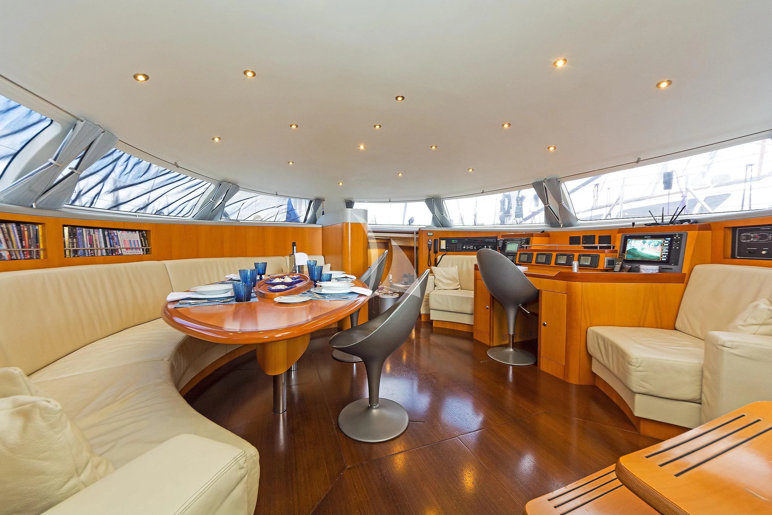 a room with a table and chairs aboard MELITI Yacht for Sale