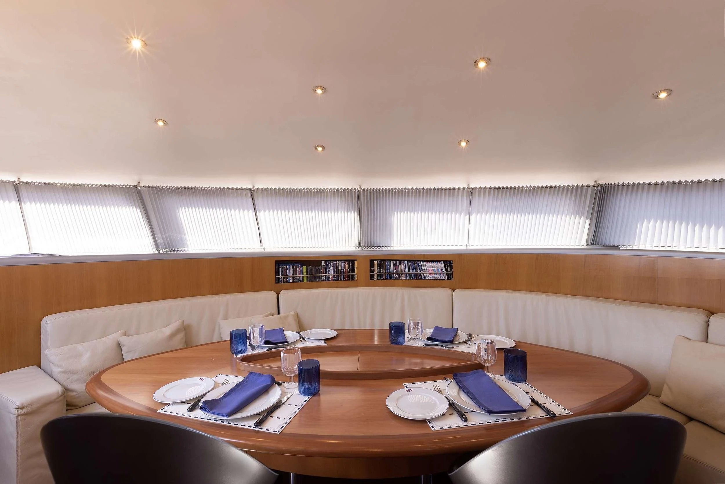 a table with plates and cups on it aboard MELITI Yacht for Sale