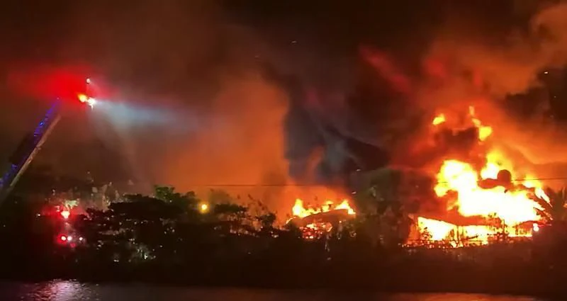 a large fire in a city aboard REFLECTIONS Yacht for Sale