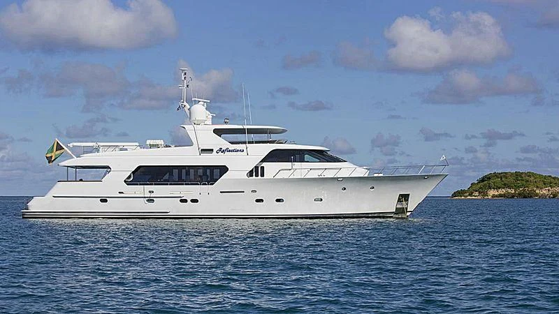 a white yacht in the water aboard REFLECTIONS Yacht for Sale