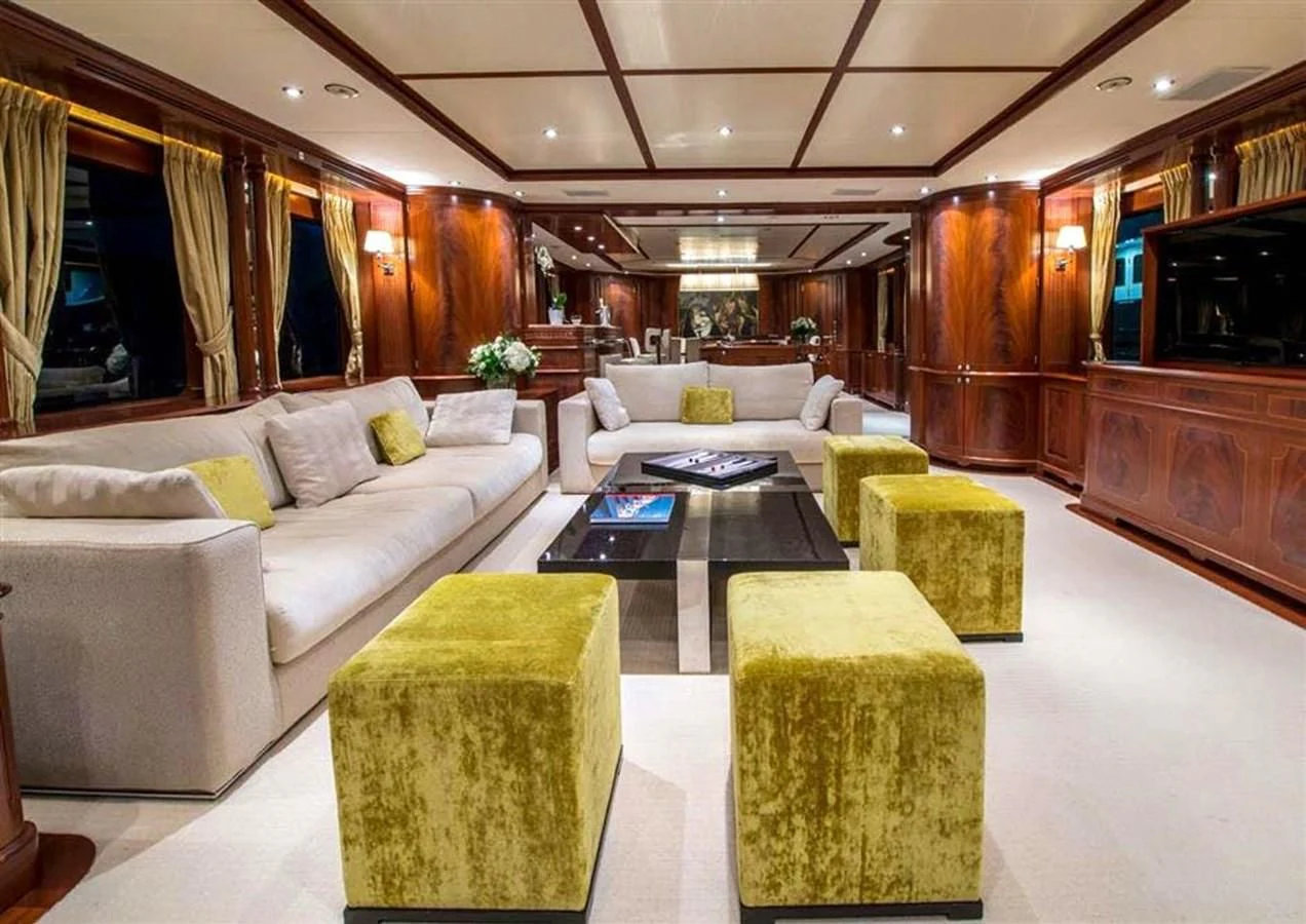 a living room with a couch and a table aboard VIRTUE Yacht for Sale