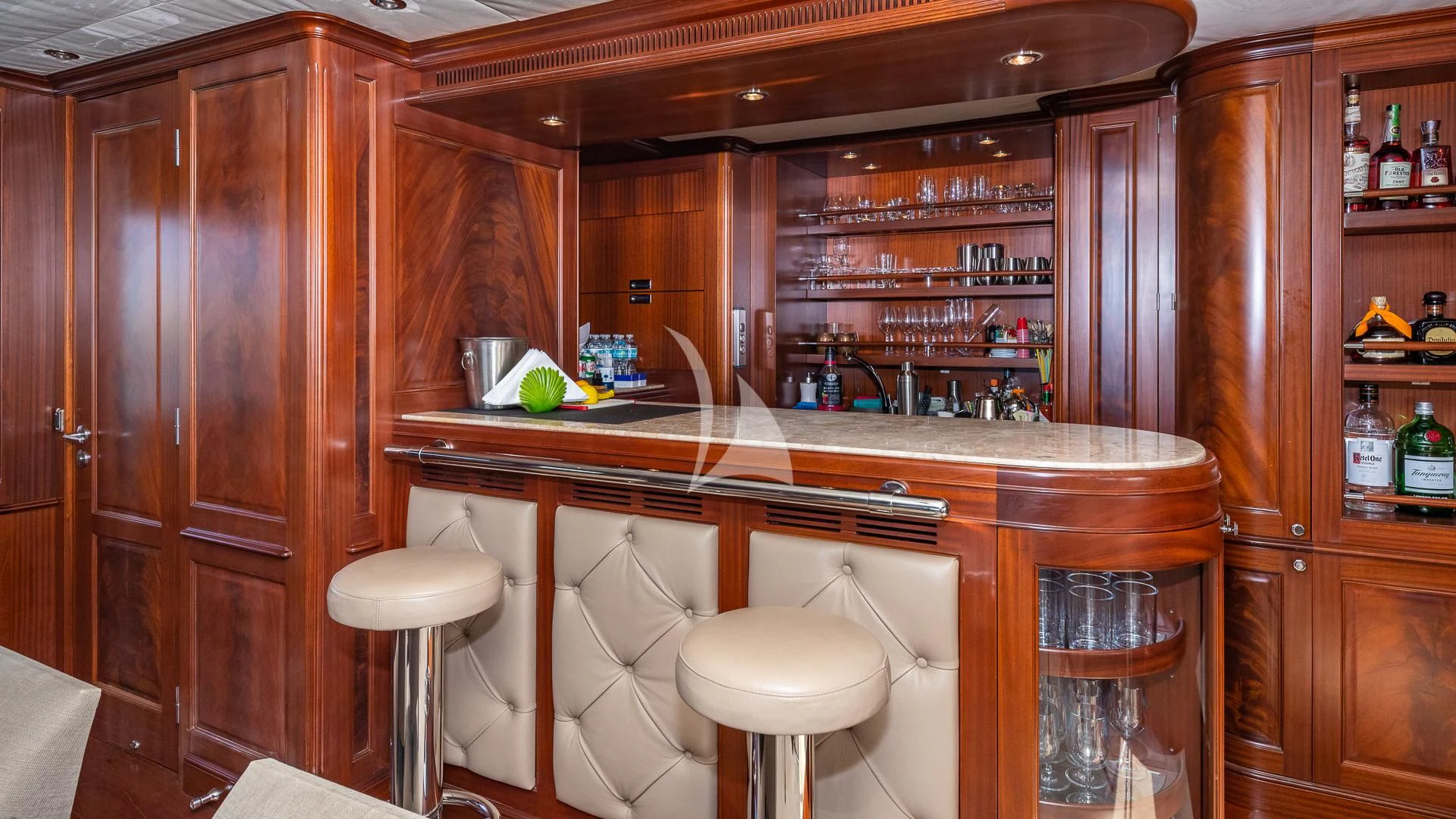 a kitchen with wooden cabinets aboard VIRTUE Yacht for Sale