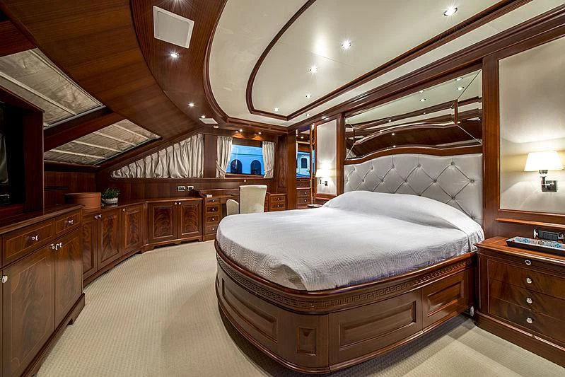 a large bedroom with a large bed aboard VIRTUE Yacht for Sale