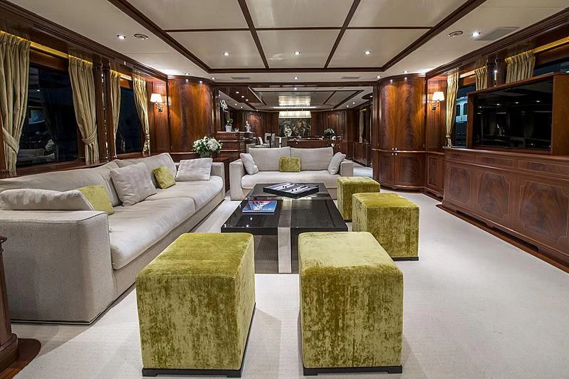 a living room with a couch and a table aboard VIRTUE Yacht for Sale