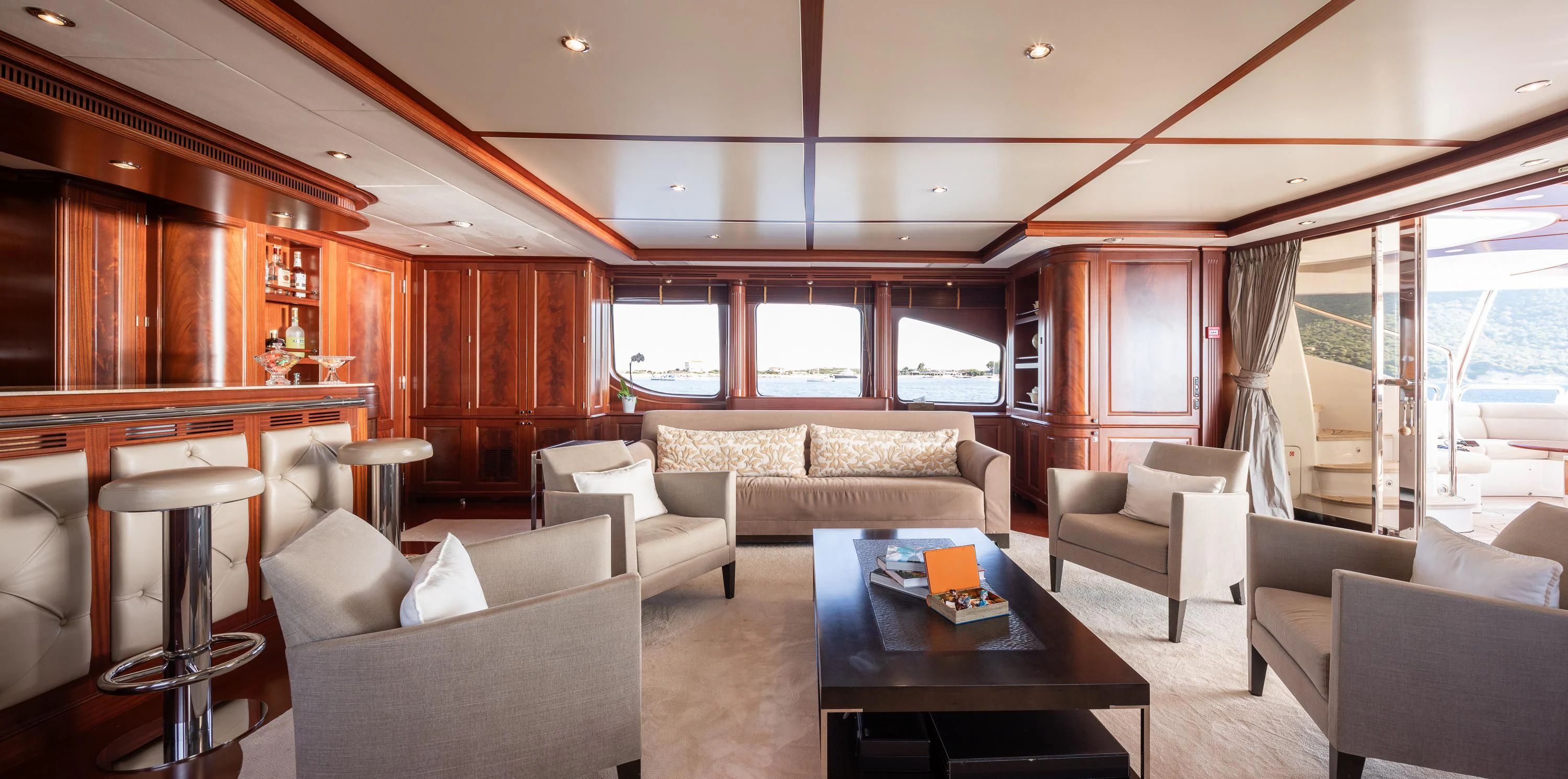 a living room with a table and chairs aboard VIRTUE Yacht for Sale