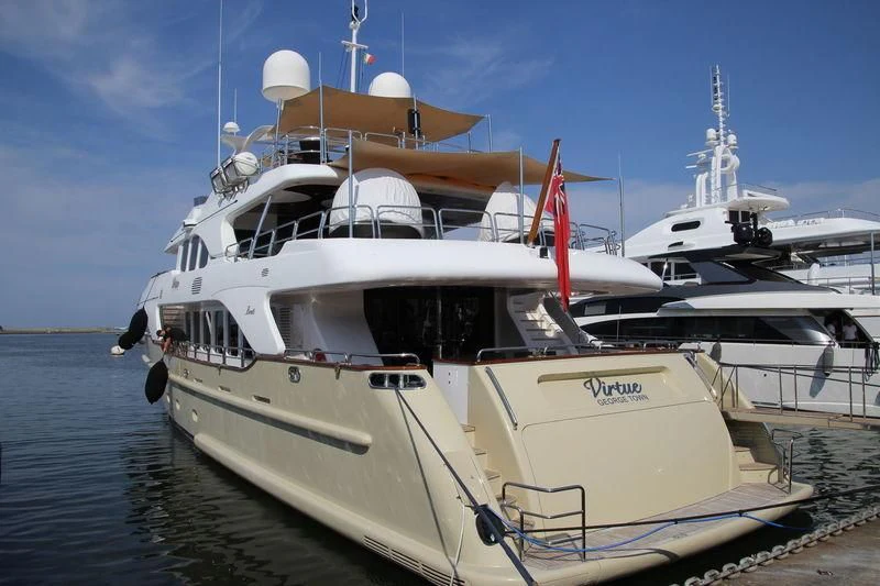 a couple of boats sit on a dock aboard VIRTUE Yacht for Sale