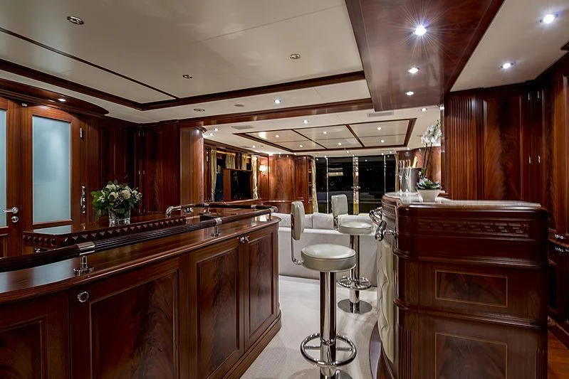 a kitchen with wooden cabinets aboard VIRTUE Yacht for Sale