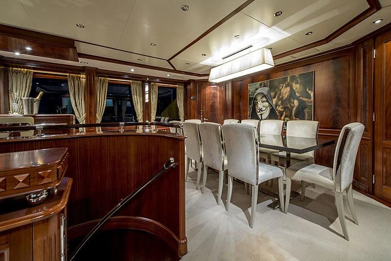 a restaurant with tables and chairs aboard VIRTUE Yacht for Sale