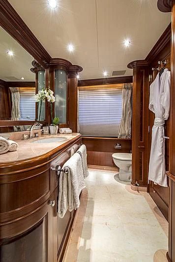 a bathroom with a large mirror aboard VIRTUE Yacht for Sale