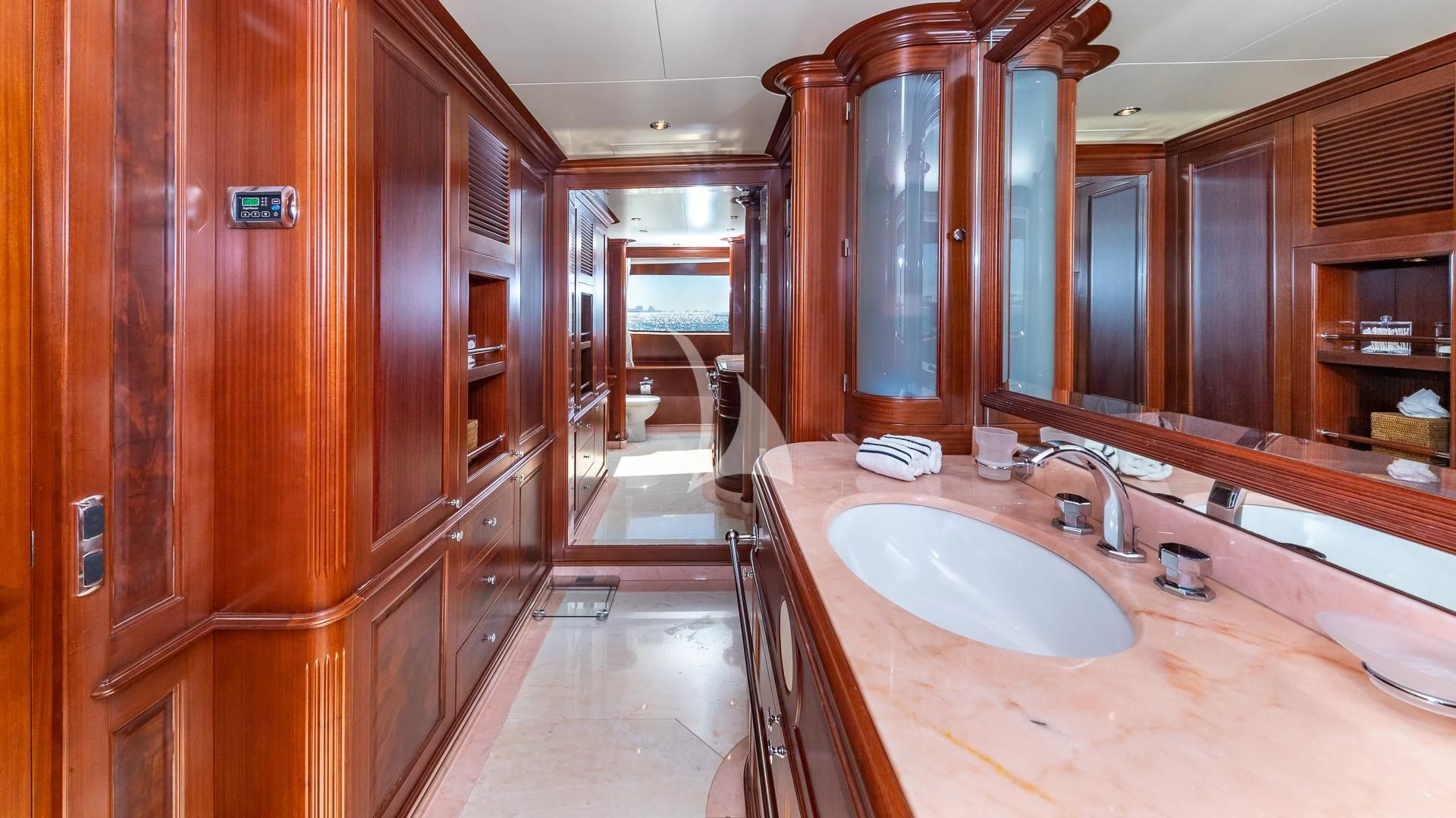 a bathroom with a countertop sink and cabinets aboard VIRTUE Yacht for Sale