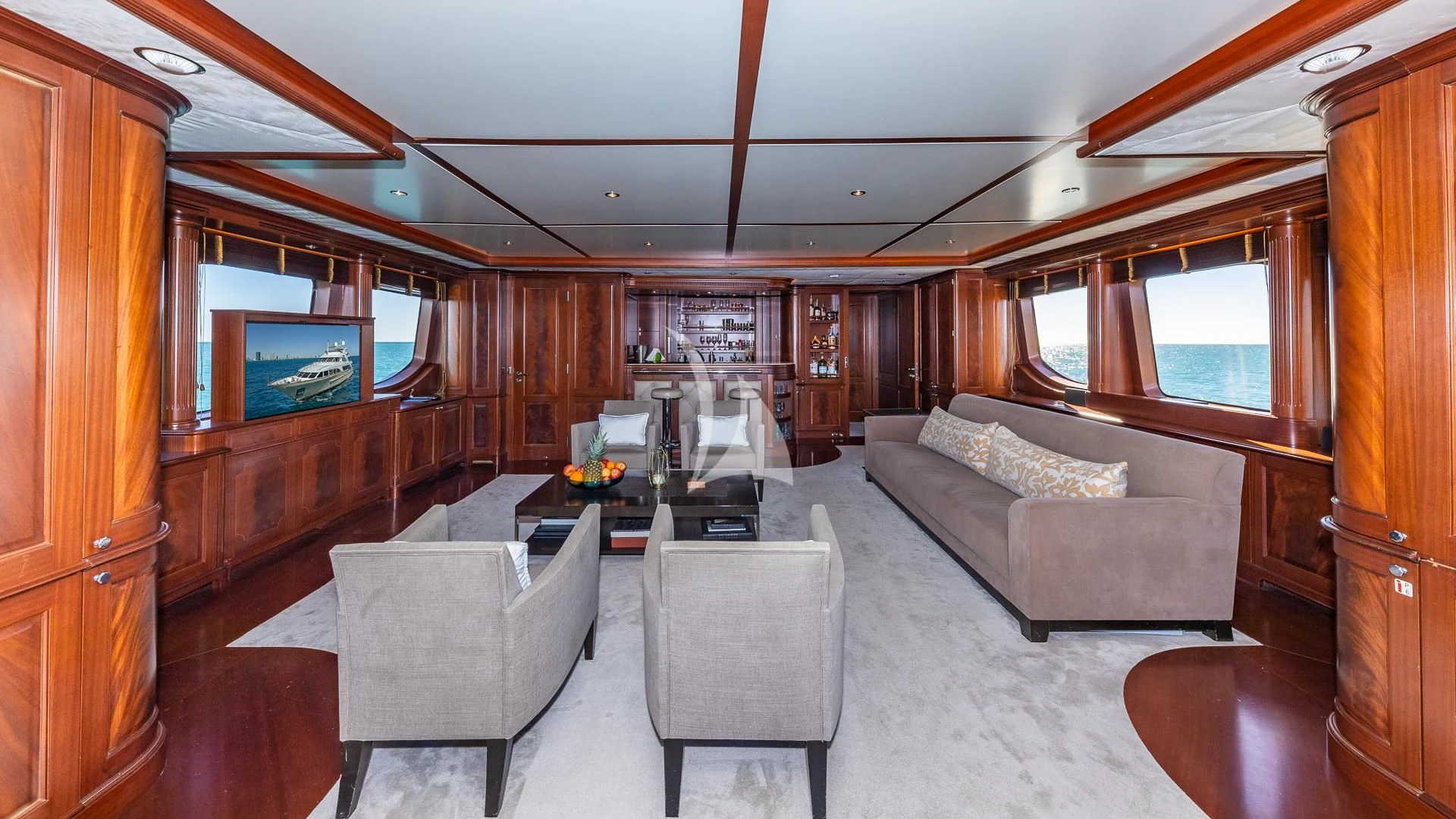 a living room with a couch and a tv aboard VIRTUE Yacht for Sale