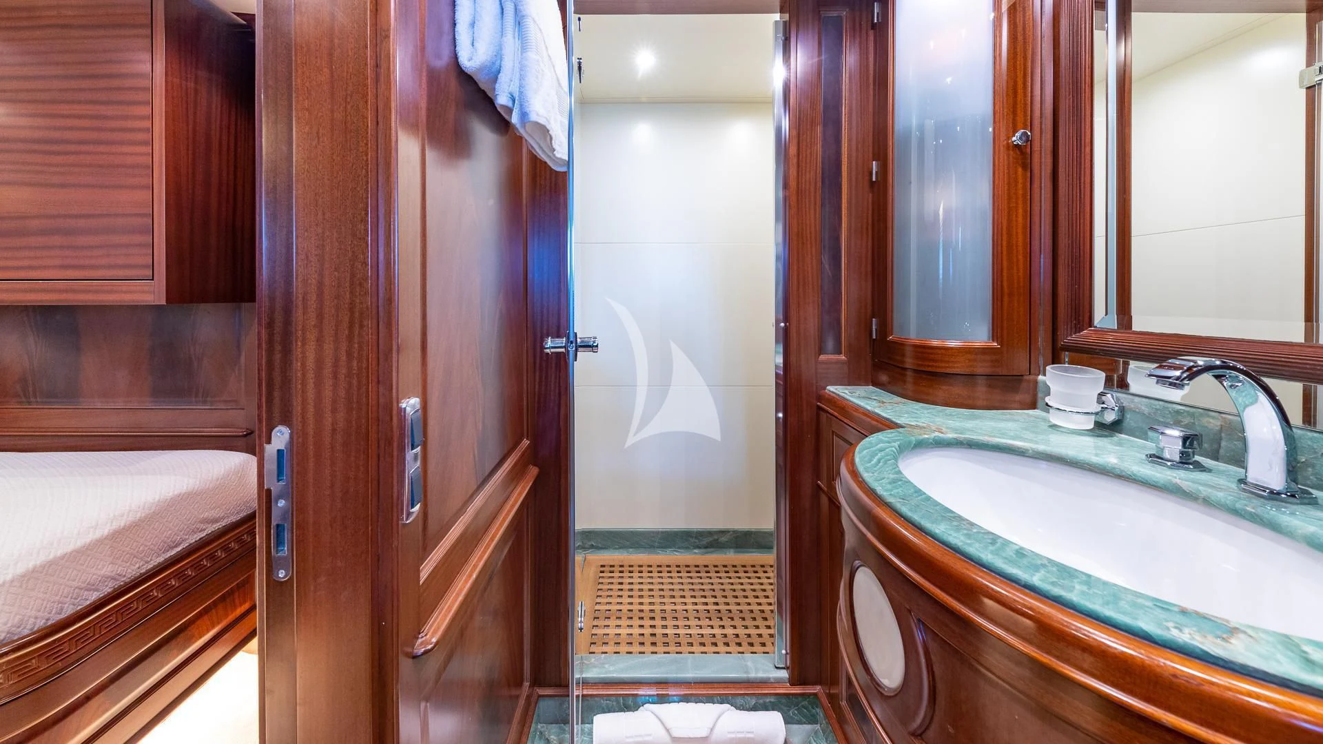 a bathroom with a sink and a mirror aboard VIRTUE Yacht for Sale