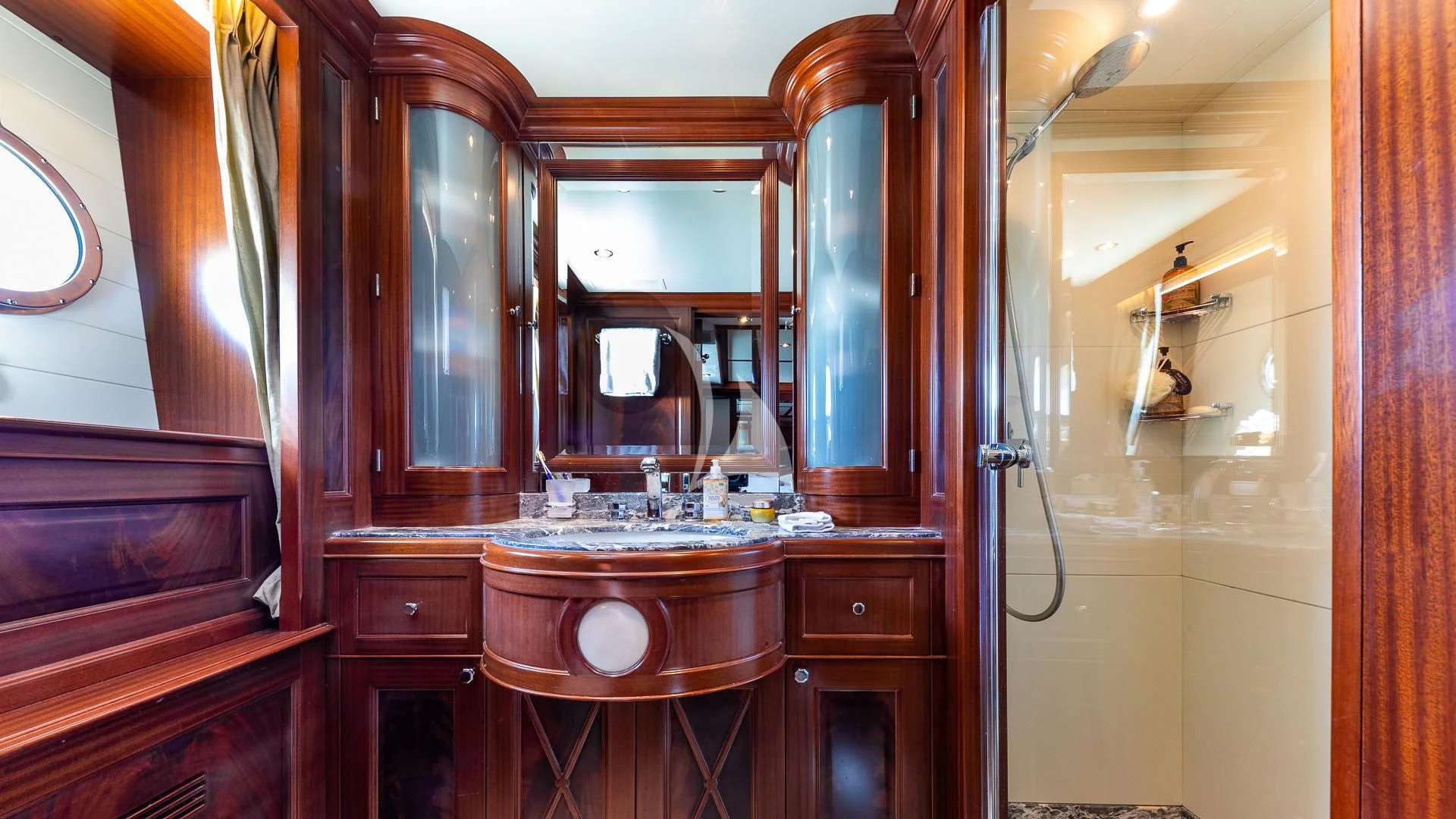 a bathroom with a sink and a mirror aboard VIRTUE Yacht for Sale
