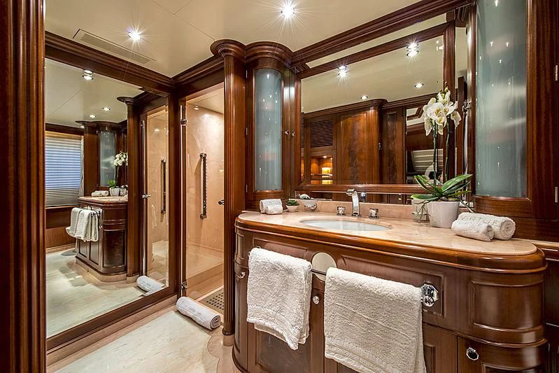 a bathroom with a large mirror aboard VIRTUE Yacht for Sale