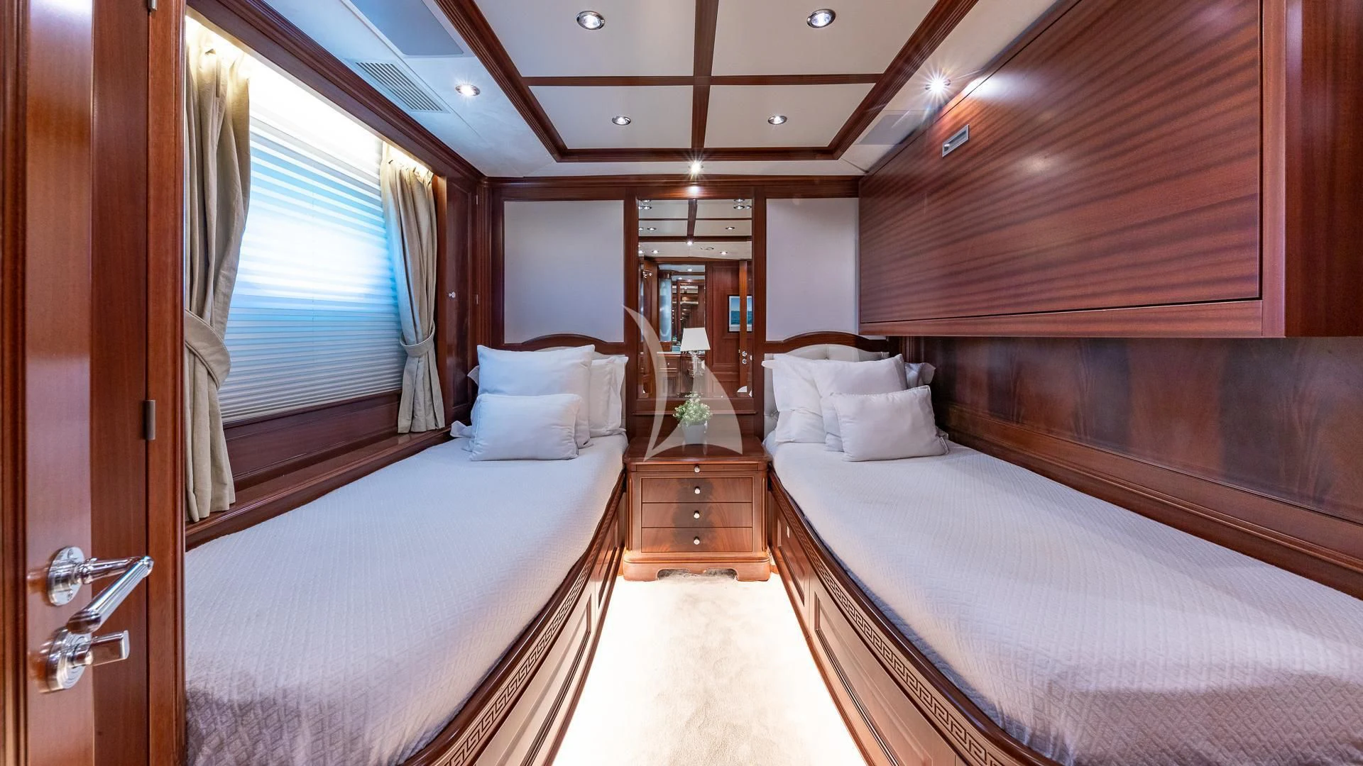 a room with a bed and a door aboard VIRTUE Yacht for Sale