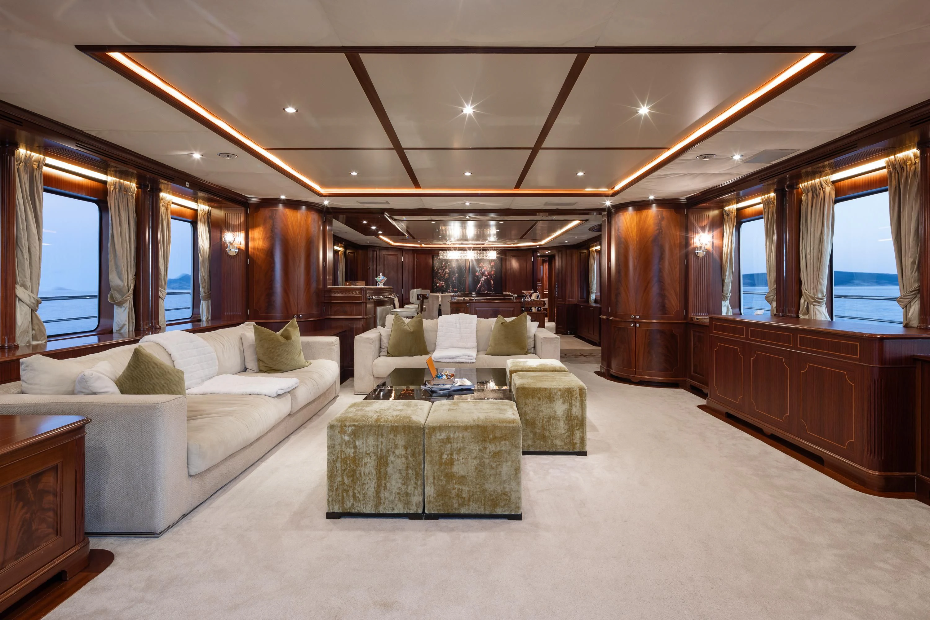 a living room with a couch and a table aboard VIRTUE Yacht for Sale