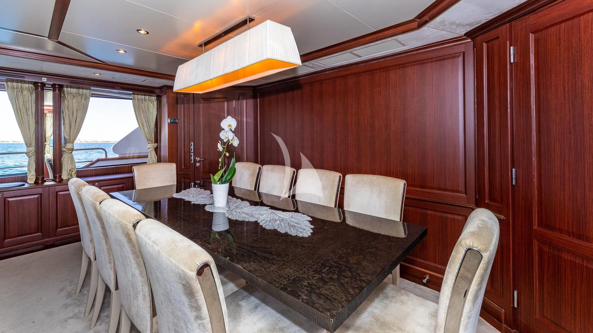 a dining table in a room aboard VIRTUE Yacht for Sale