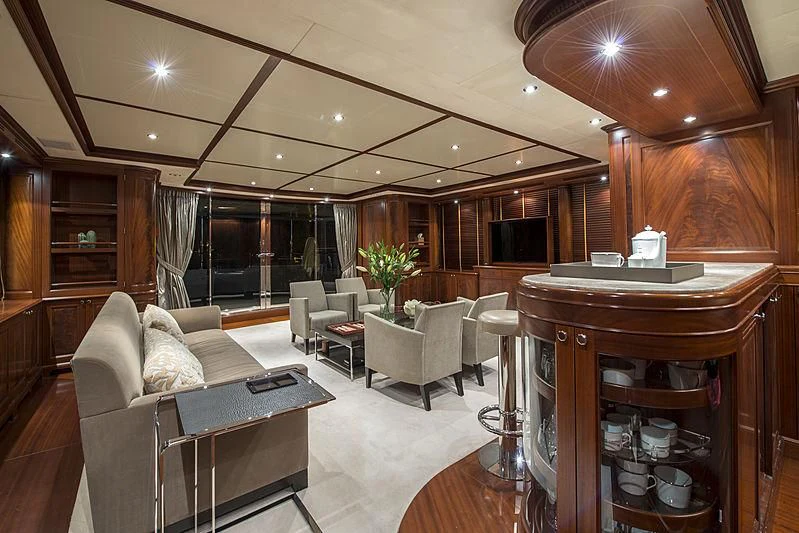 a living room with wood walls aboard VIRTUE Yacht for Sale