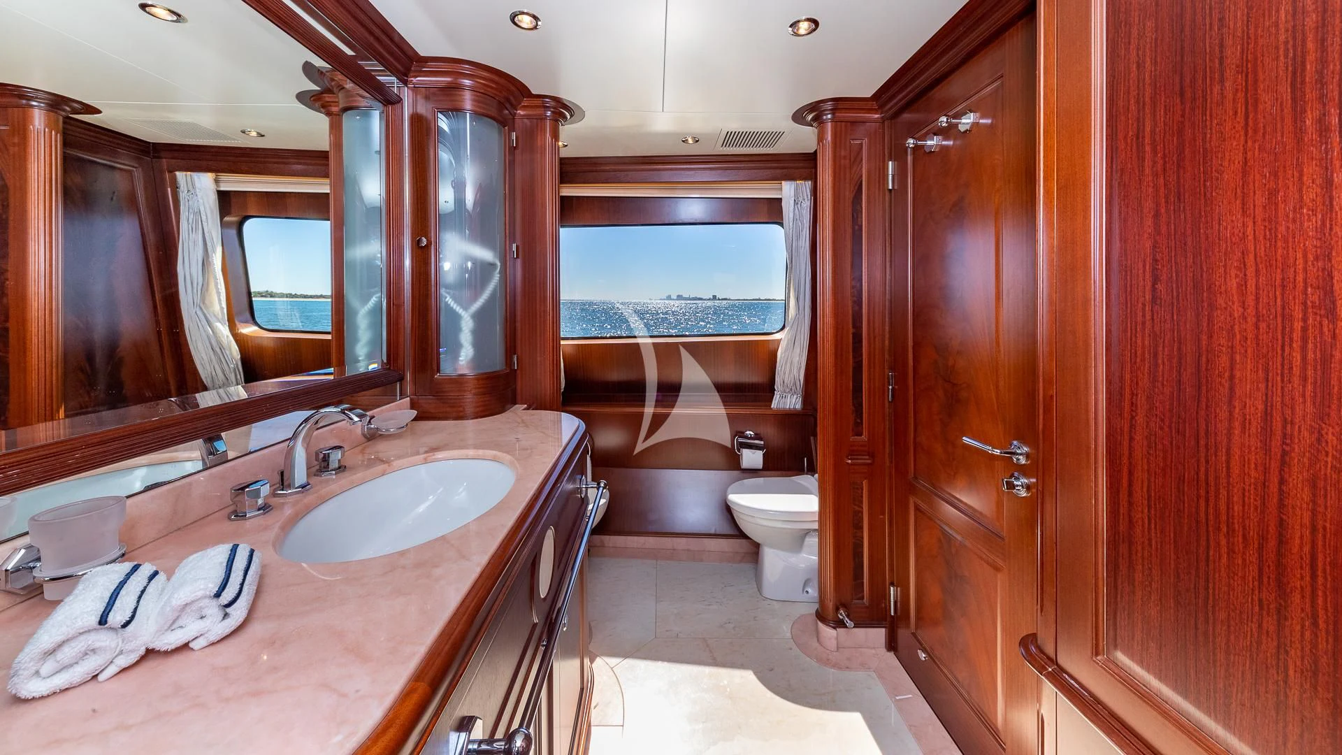 a bathroom with a large mirror aboard VIRTUE Yacht for Sale