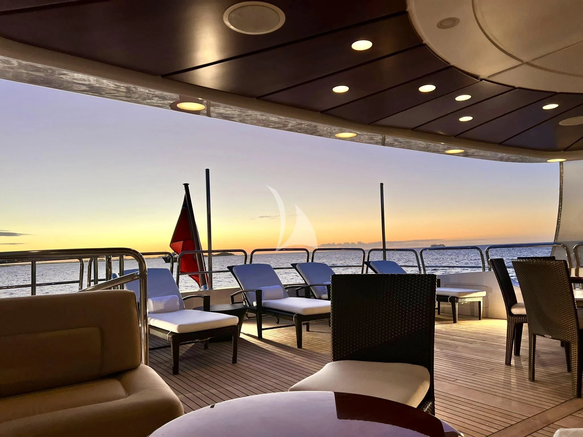 a large swimming pool with chairs and tables aboard VIRTUE Yacht for Sale