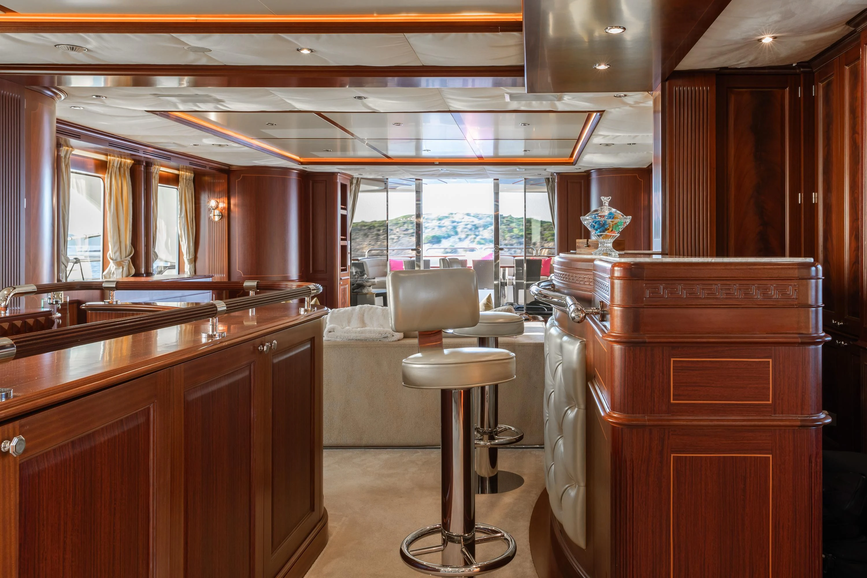 a kitchen with a bar and stool aboard VIRTUE Yacht for Sale
