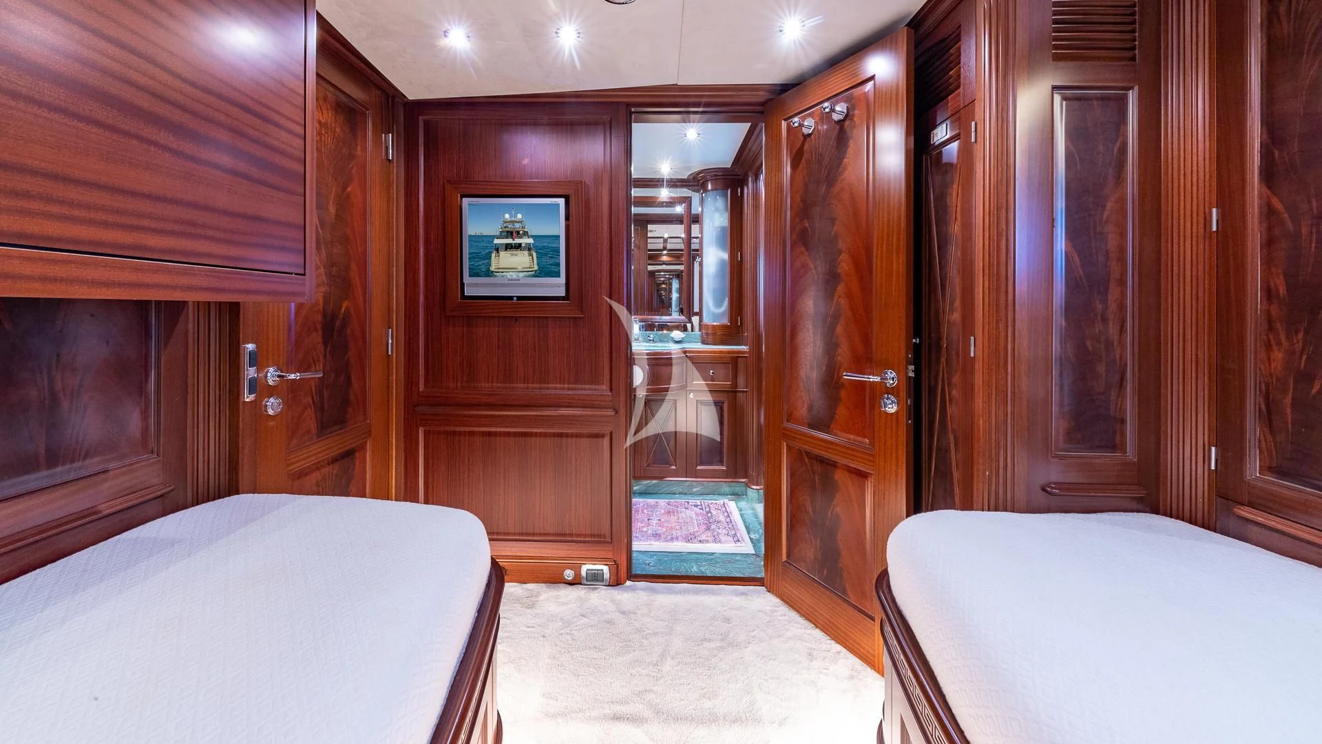 a room with a bed and a television aboard VIRTUE Yacht for Sale