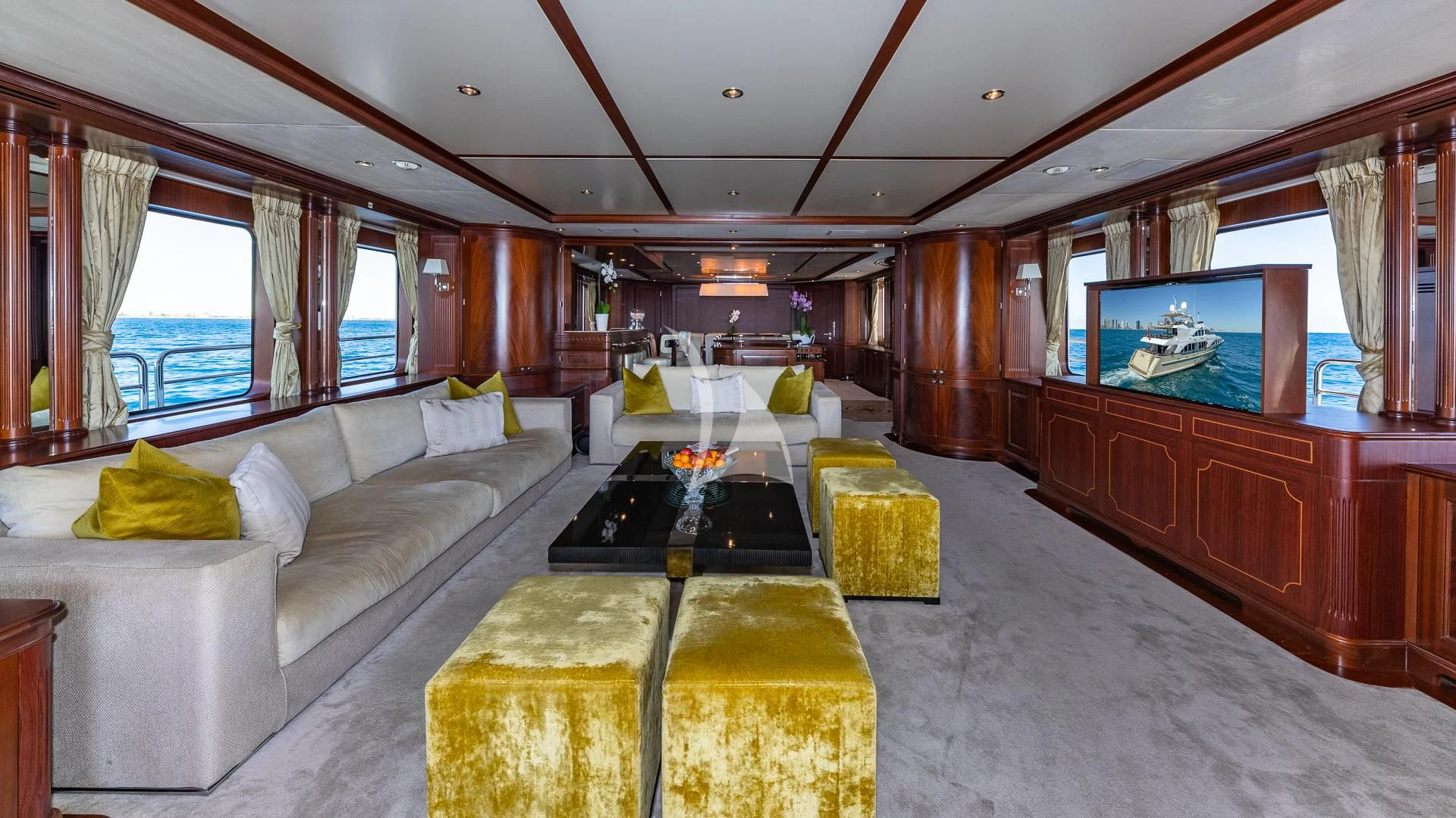 a living room with a large screen aboard VIRTUE Yacht for Sale