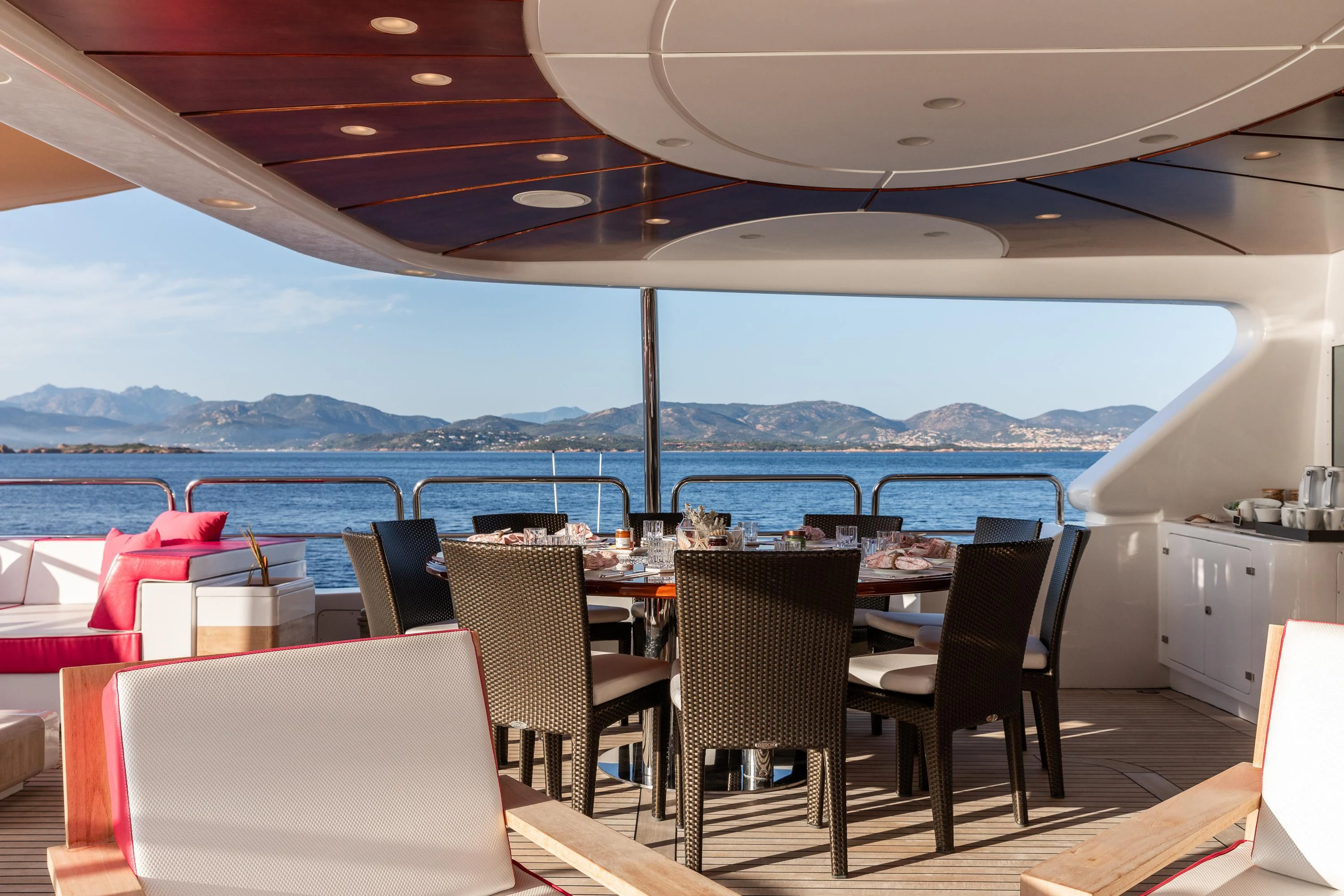 a table set for a meal on a boat aboard VIRTUE Yacht for Sale