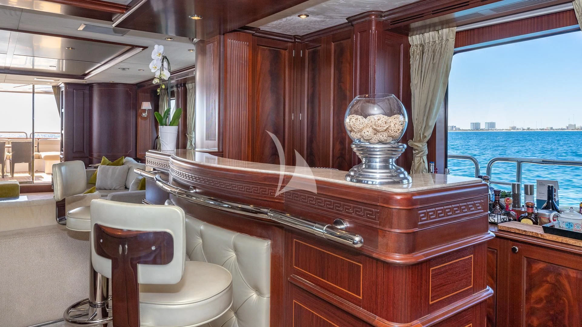 a kitchen with a large wood cabinet aboard VIRTUE Yacht for Sale