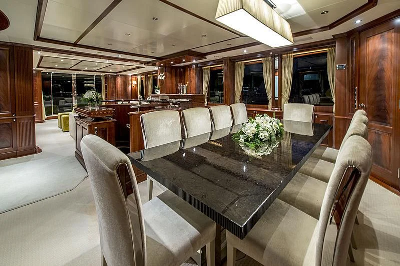 a large room with chairs and tables aboard VIRTUE Yacht for Sale