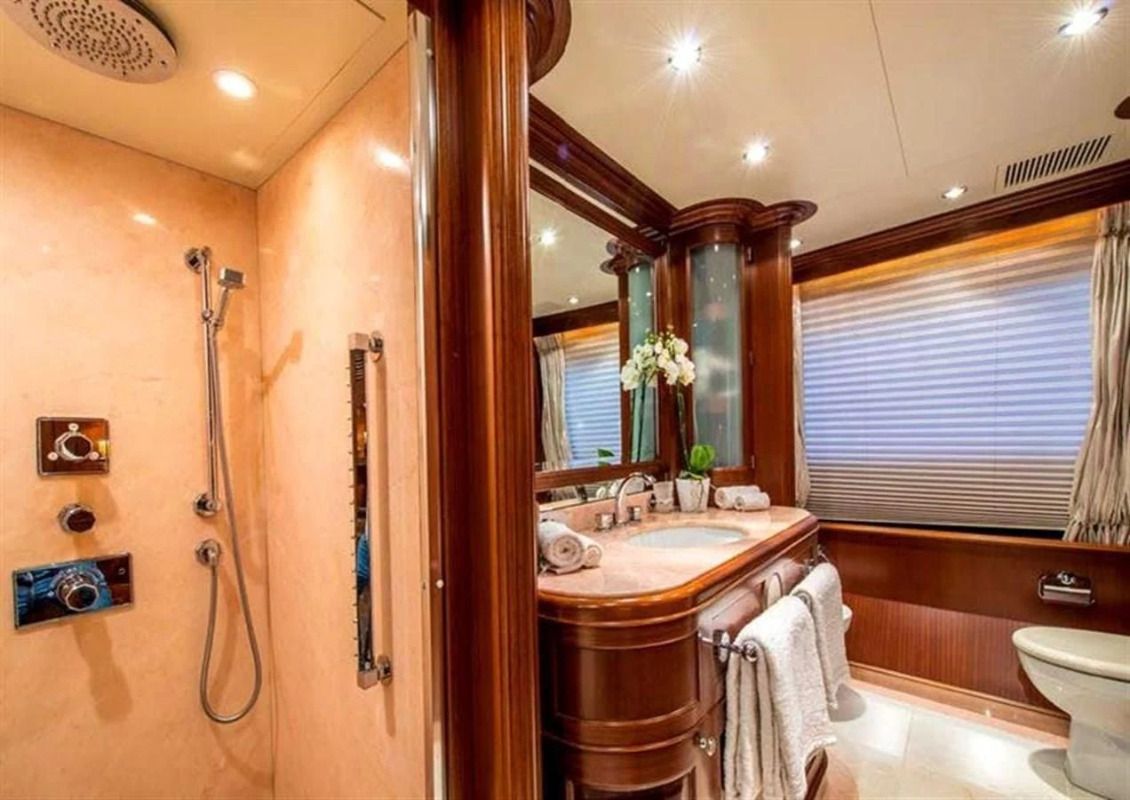 a bathroom with a sink and a mirror aboard VIRTUE Yacht for Sale