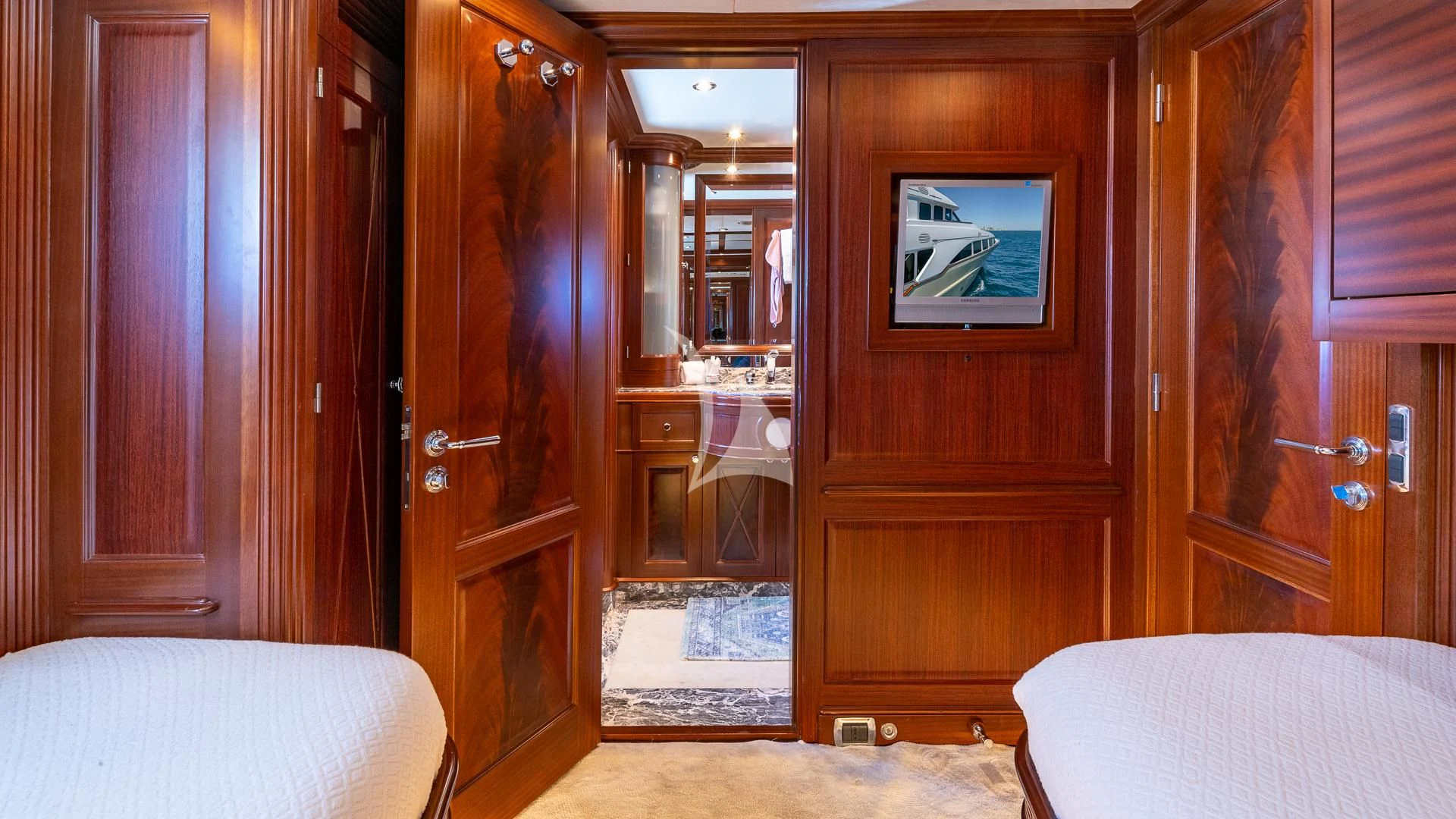 a room with a bed and a mirror aboard VIRTUE Yacht for Sale