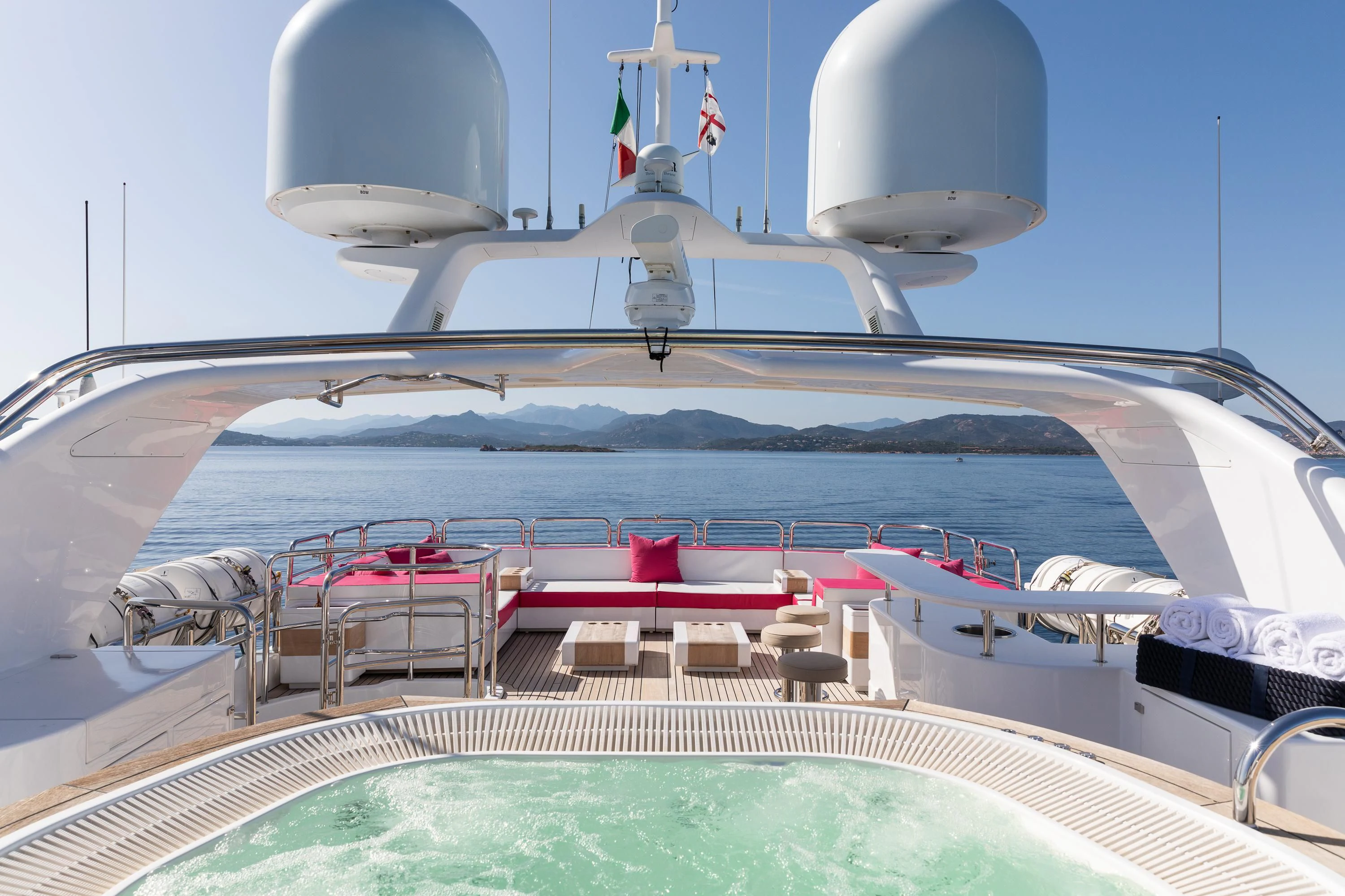 a large ship with a deck and chairs on the deck aboard VIRTUE Yacht for Sale