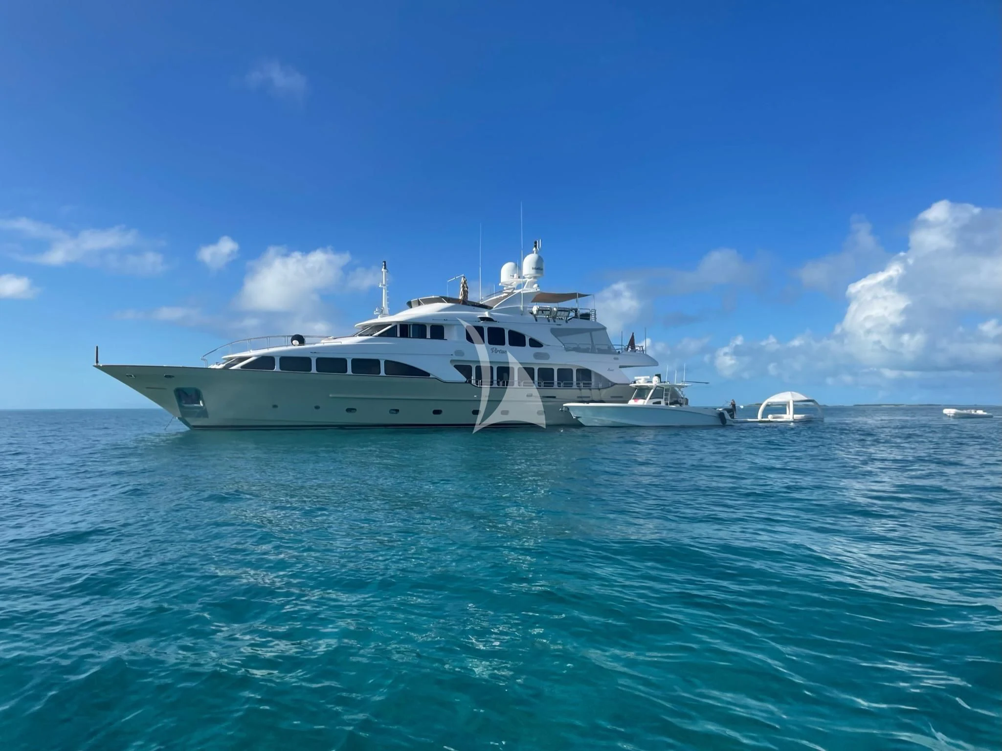 a white yacht in the water aboard VIRTUE Yacht for Sale