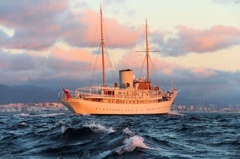 a large orange boat in the water aboard NAHLIN Yacht for Sale