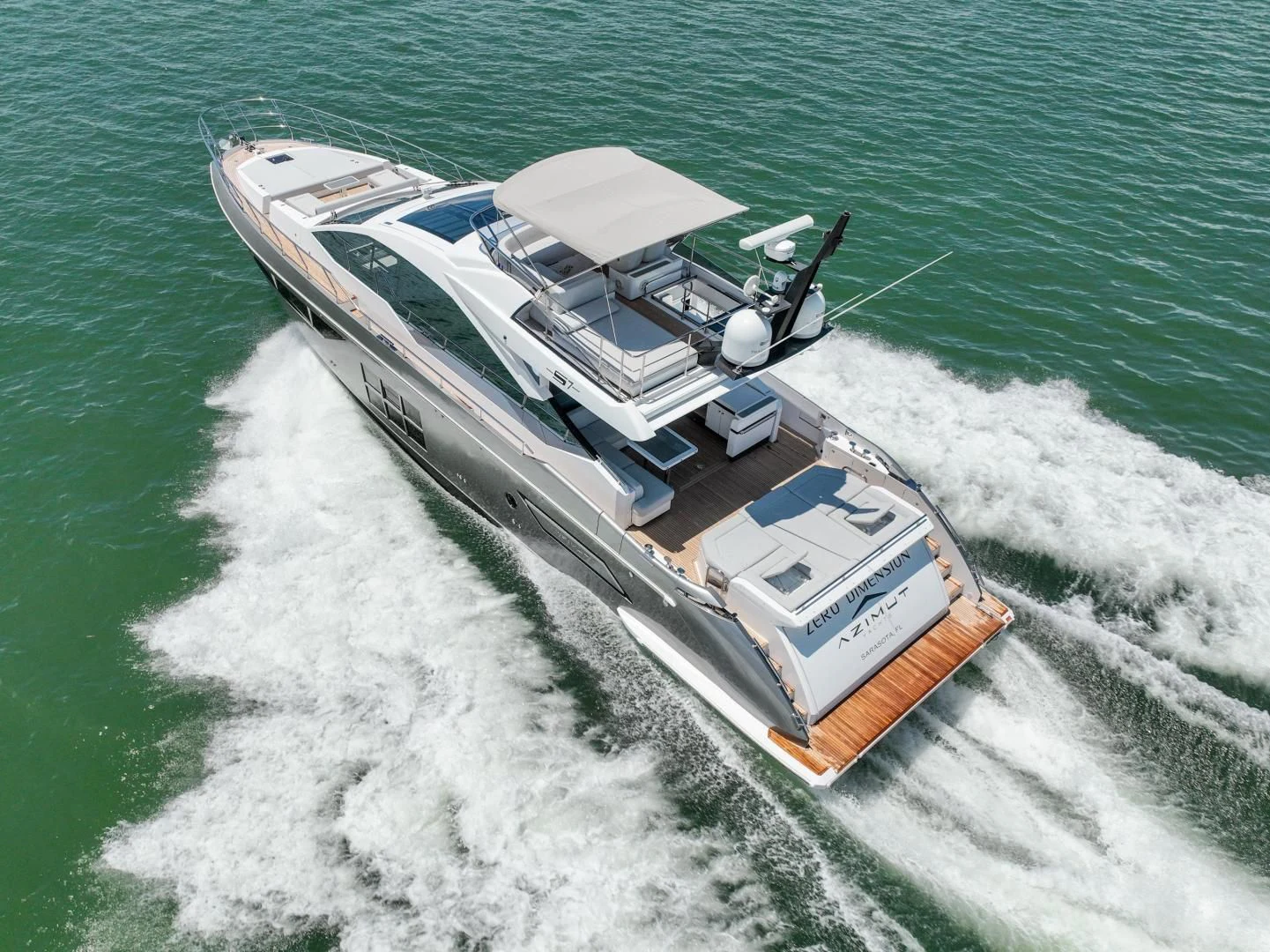 a helicopter flying over a boat on the water aboard ZERO DIMENSION Yacht for Sale