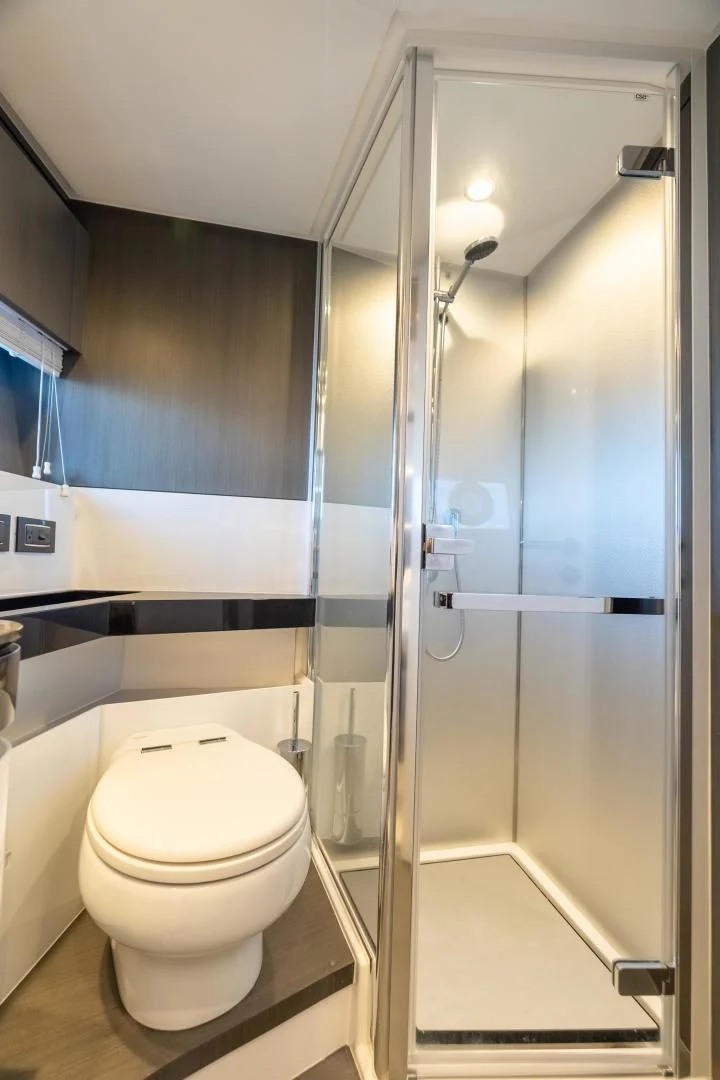 a bathroom with a glass shower aboard ZERO DIMENSION Yacht for Sale