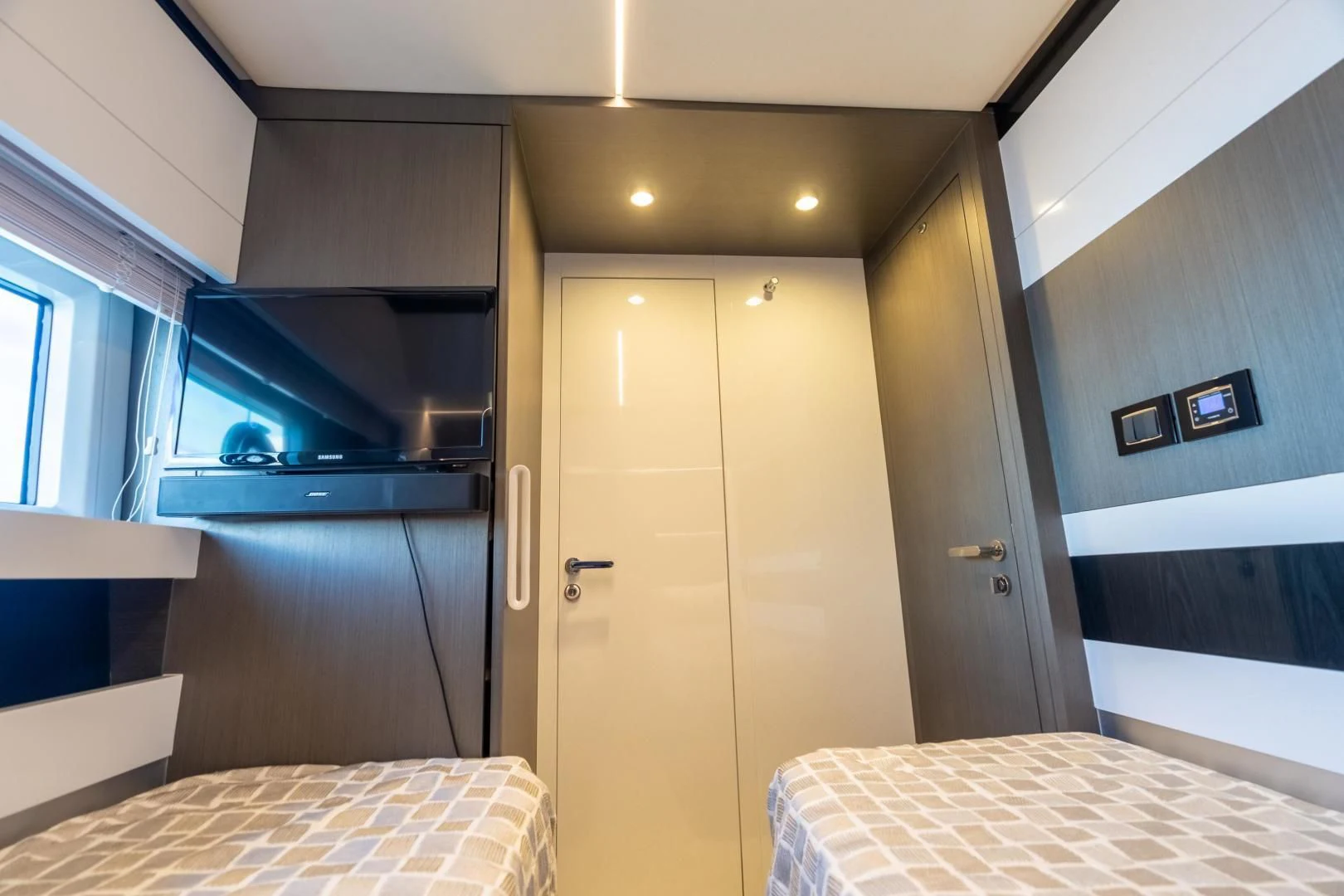a room with a bed and a door aboard ZERO DIMENSION Yacht for Sale