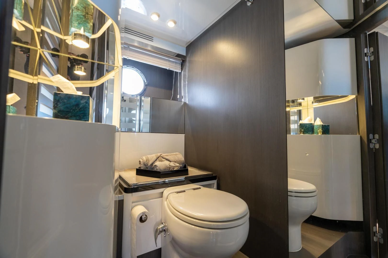 a bathroom with a toilet and sink aboard ZERO DIMENSION Yacht for Sale