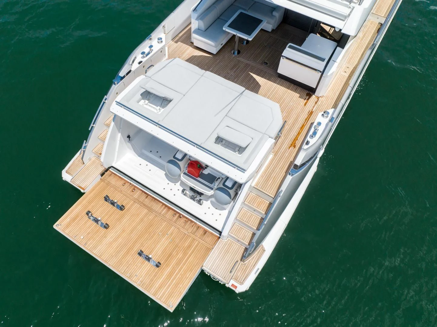 a white car on a green lawn aboard ZERO DIMENSION Yacht for Sale