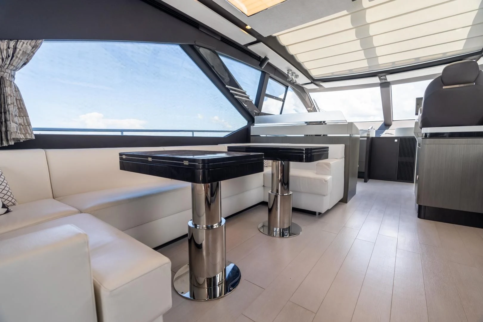 a large room with a table and chairs aboard ZERO DIMENSION Yacht for Sale