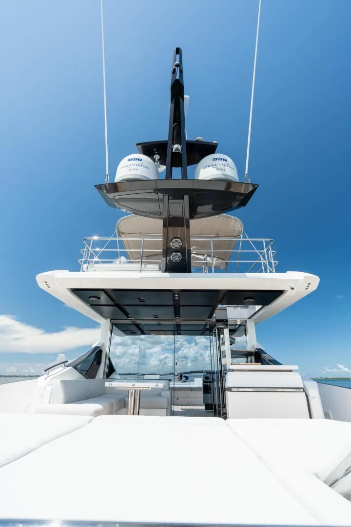 a white boat with a black and silver tower on top aboard ZERO DIMENSION Yacht for Sale
