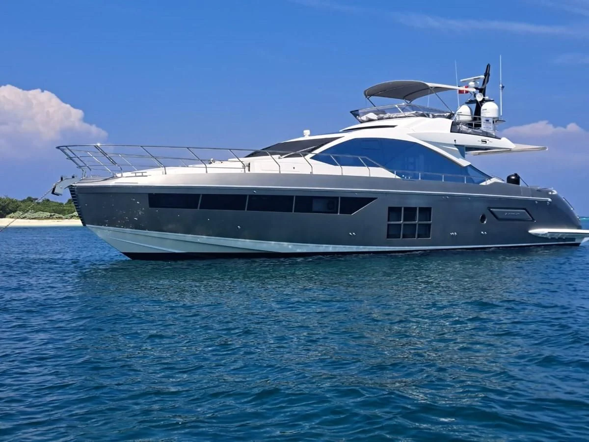 a white boat in the water aboard ZERO DIMENSION Yacht for Sale